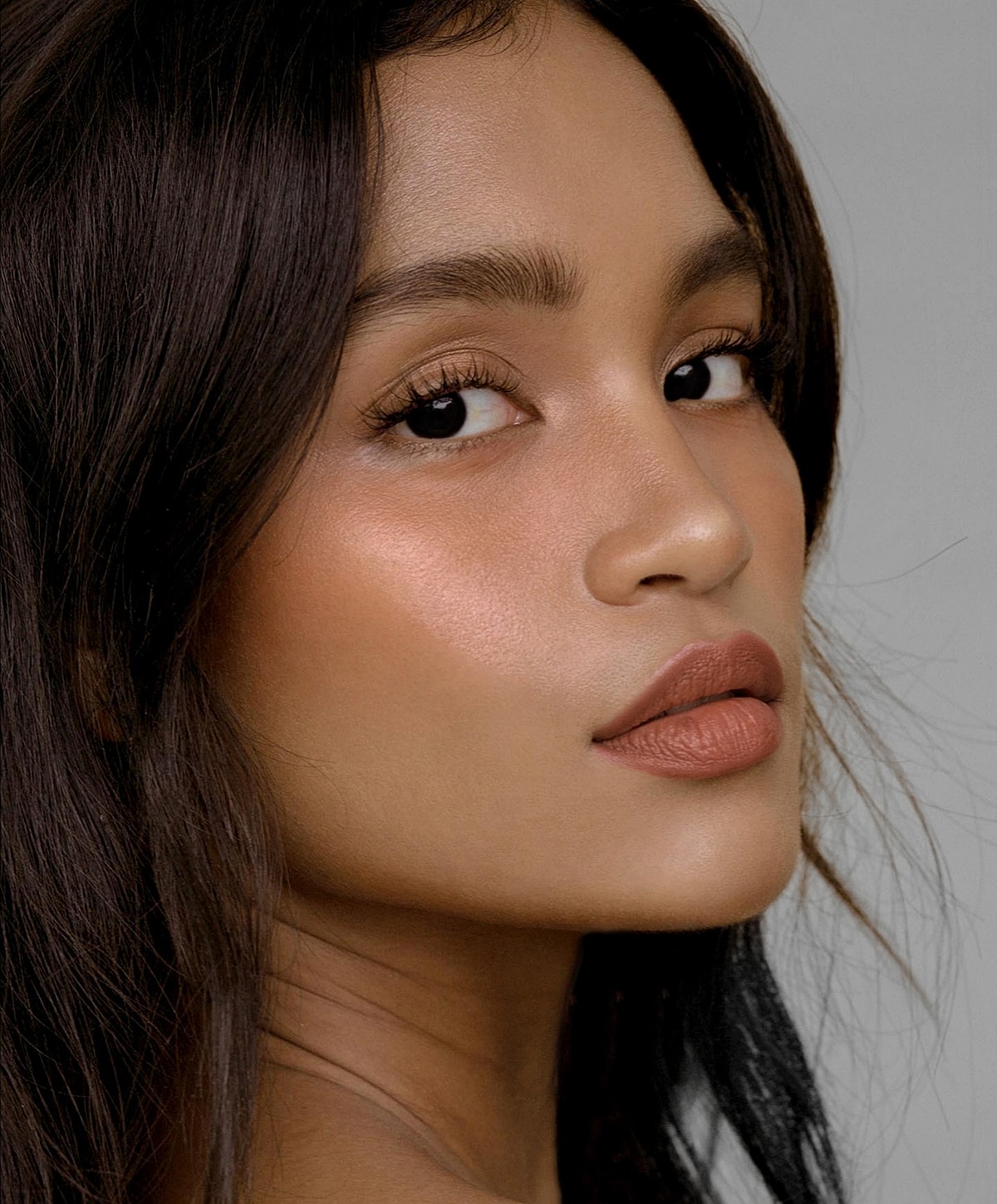 Profile of a woman with glowing skin.