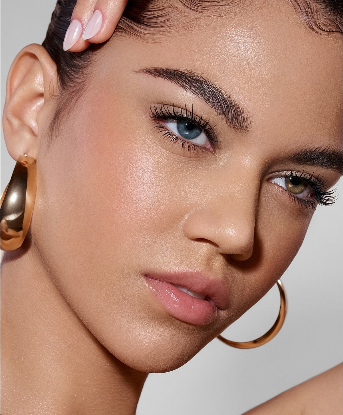 Close-up of a woman with striking features.