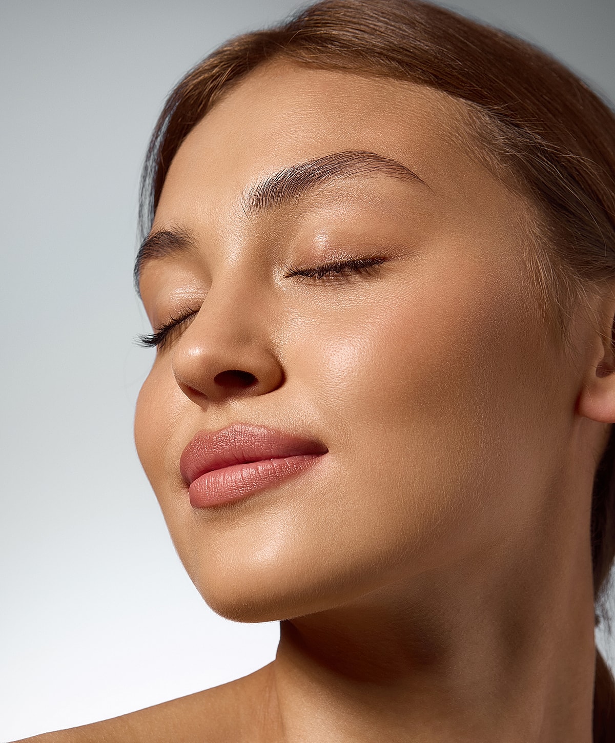 Close-up of a woman's serene facial profile.