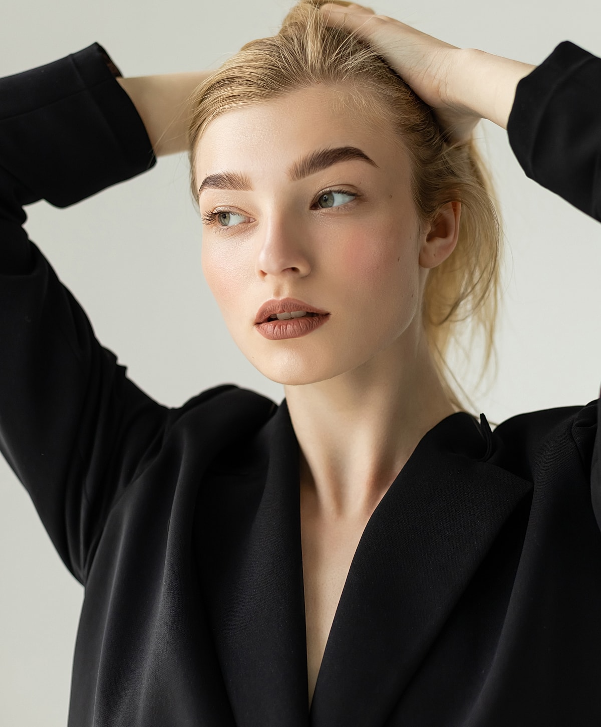 Portrait of a woman in black outfit.