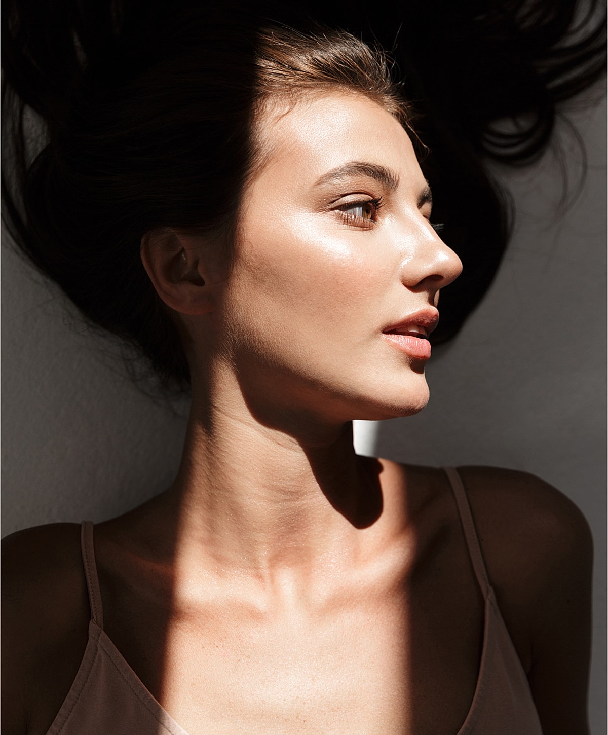 Profile of a woman with soft, natural lighting.