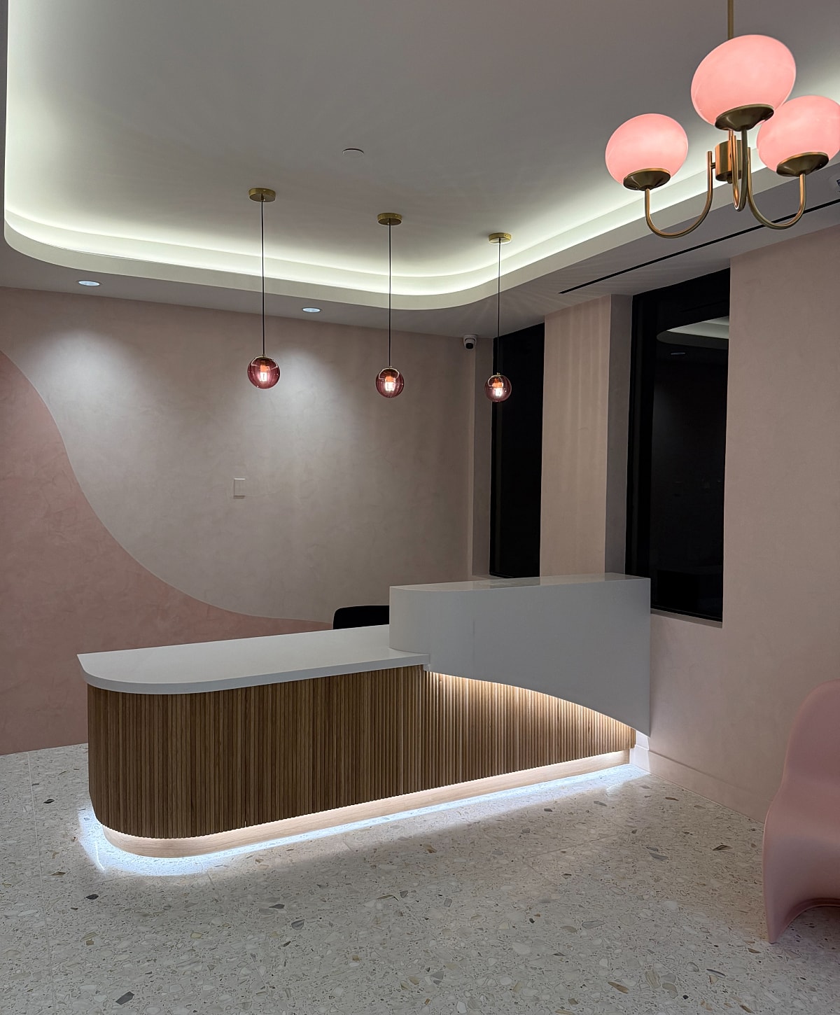 Modern reception area with stylish lighting fixtures.