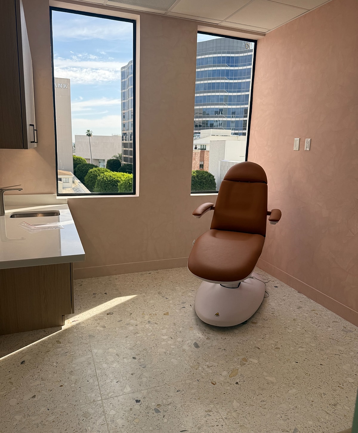 Empty dental office with a reclining chair.
