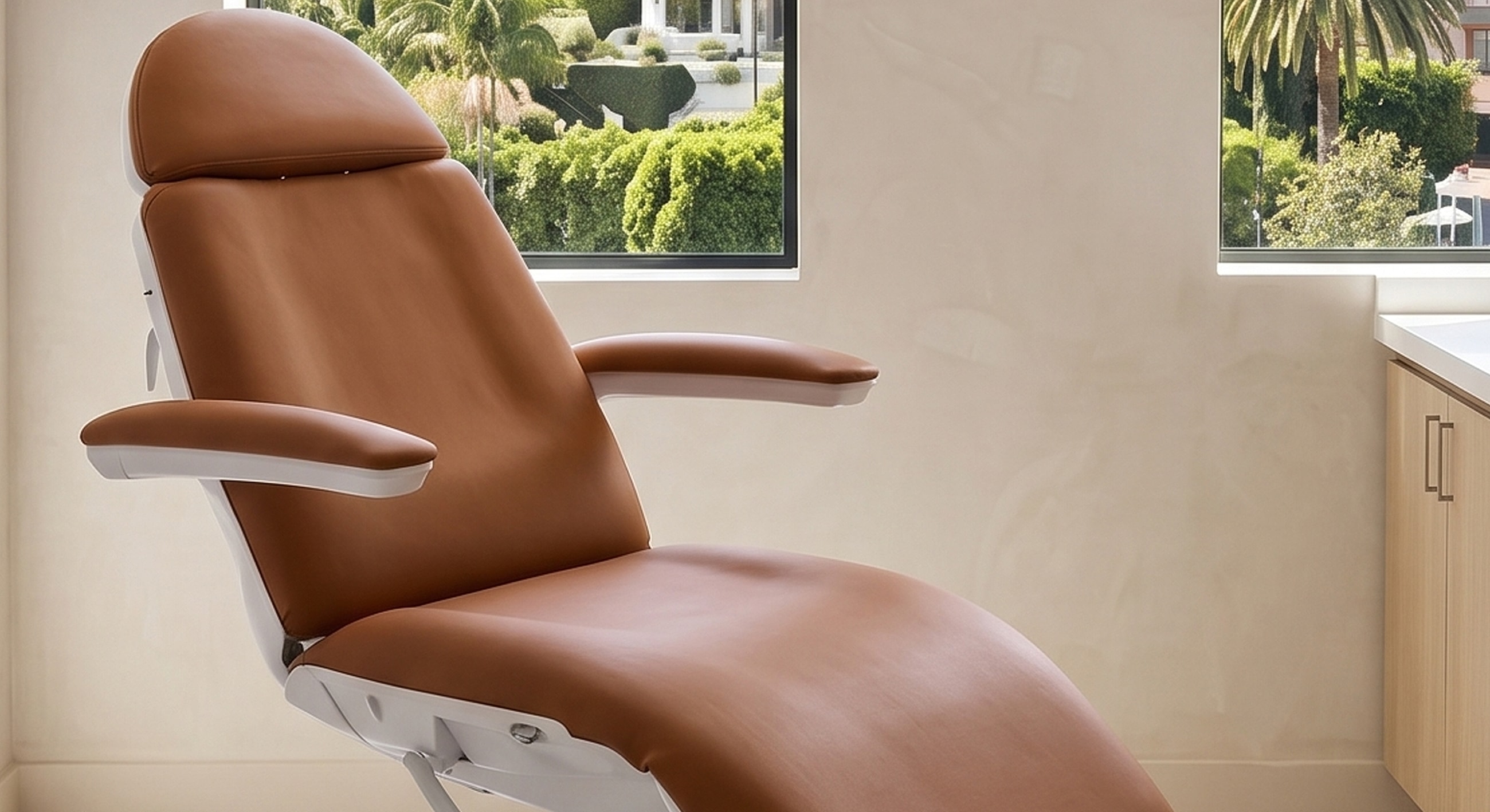 Healthcare examination chair by a window.