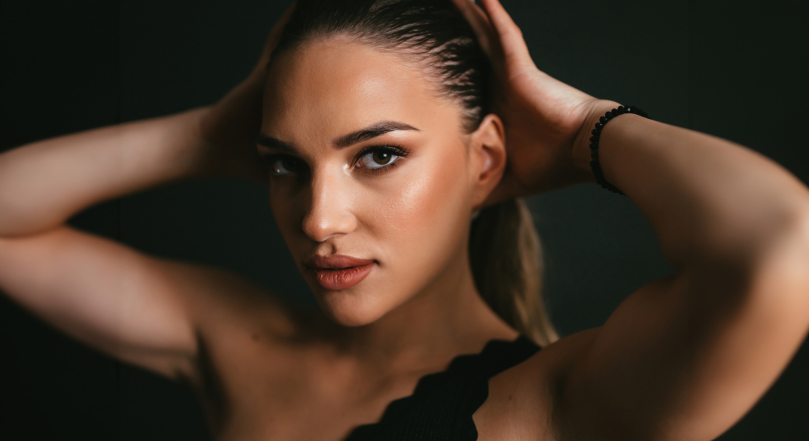Portrait of a woman with stylish hair pose.