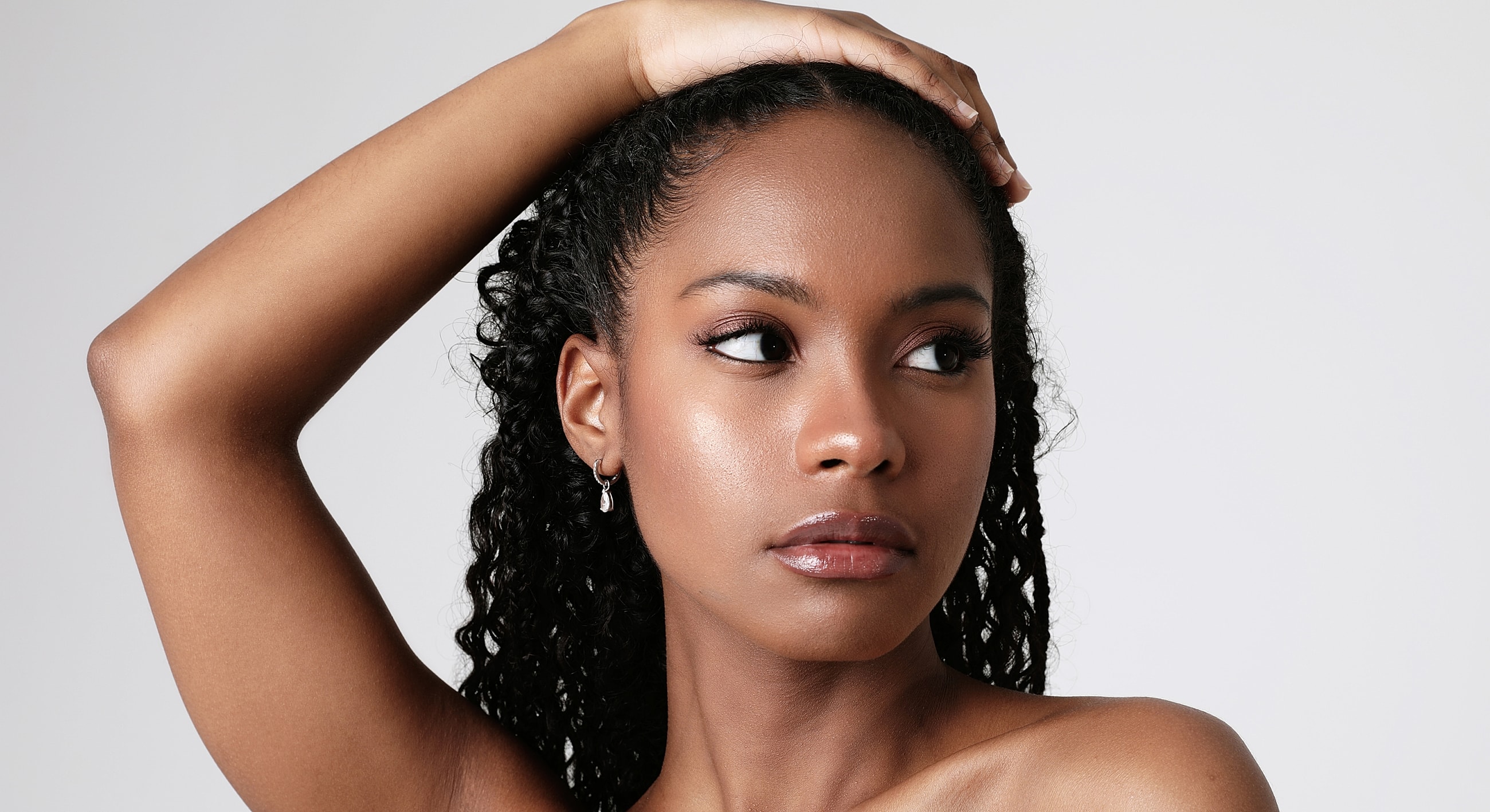 Portrait of a woman with curly hair.